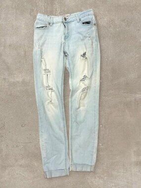 2010s light blue ripped millennial skinny jeans with custom anti-gap tailoring